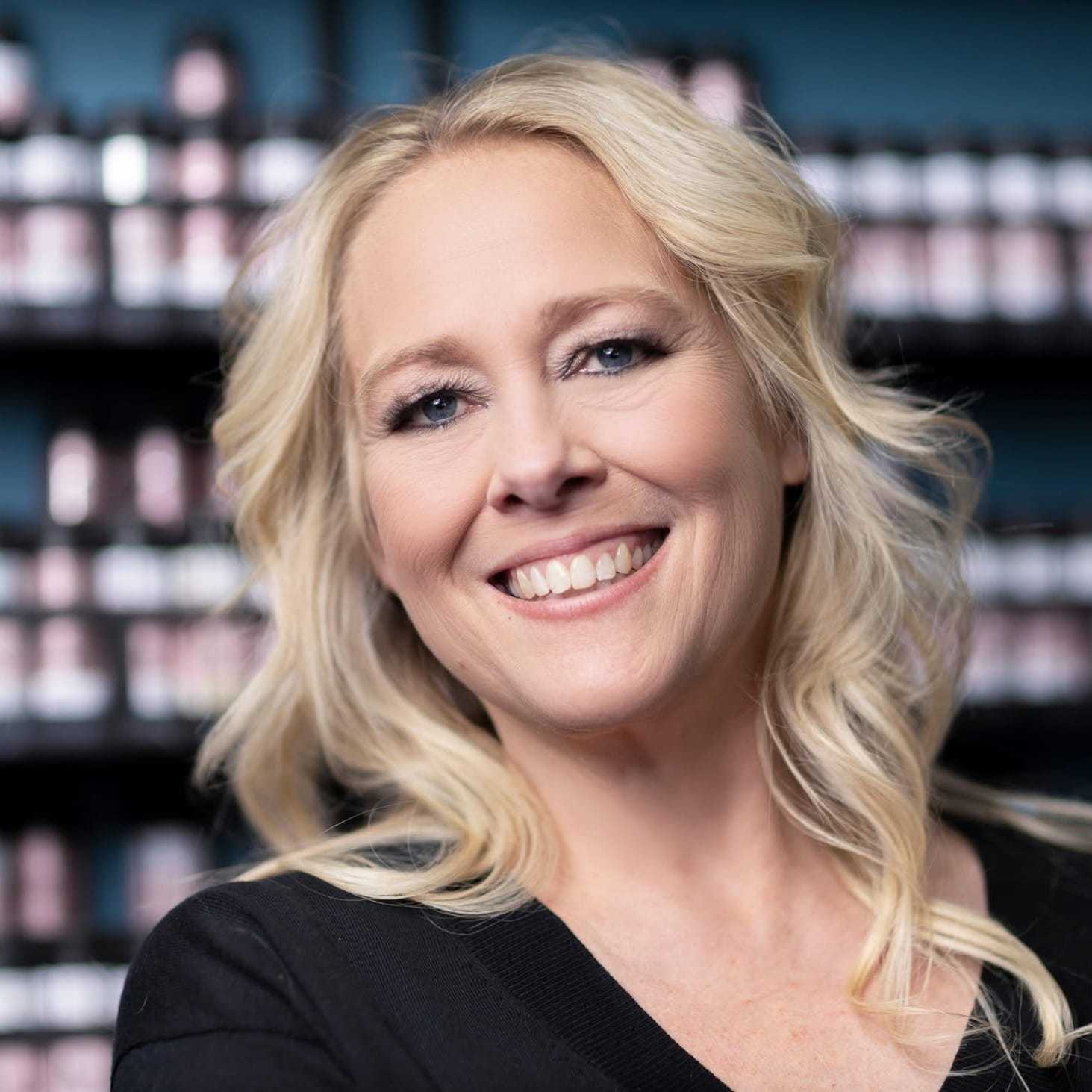 Portrait of Melissa Birmingham, a professional stylist at A & M Inc., showcasing their expertise and style.