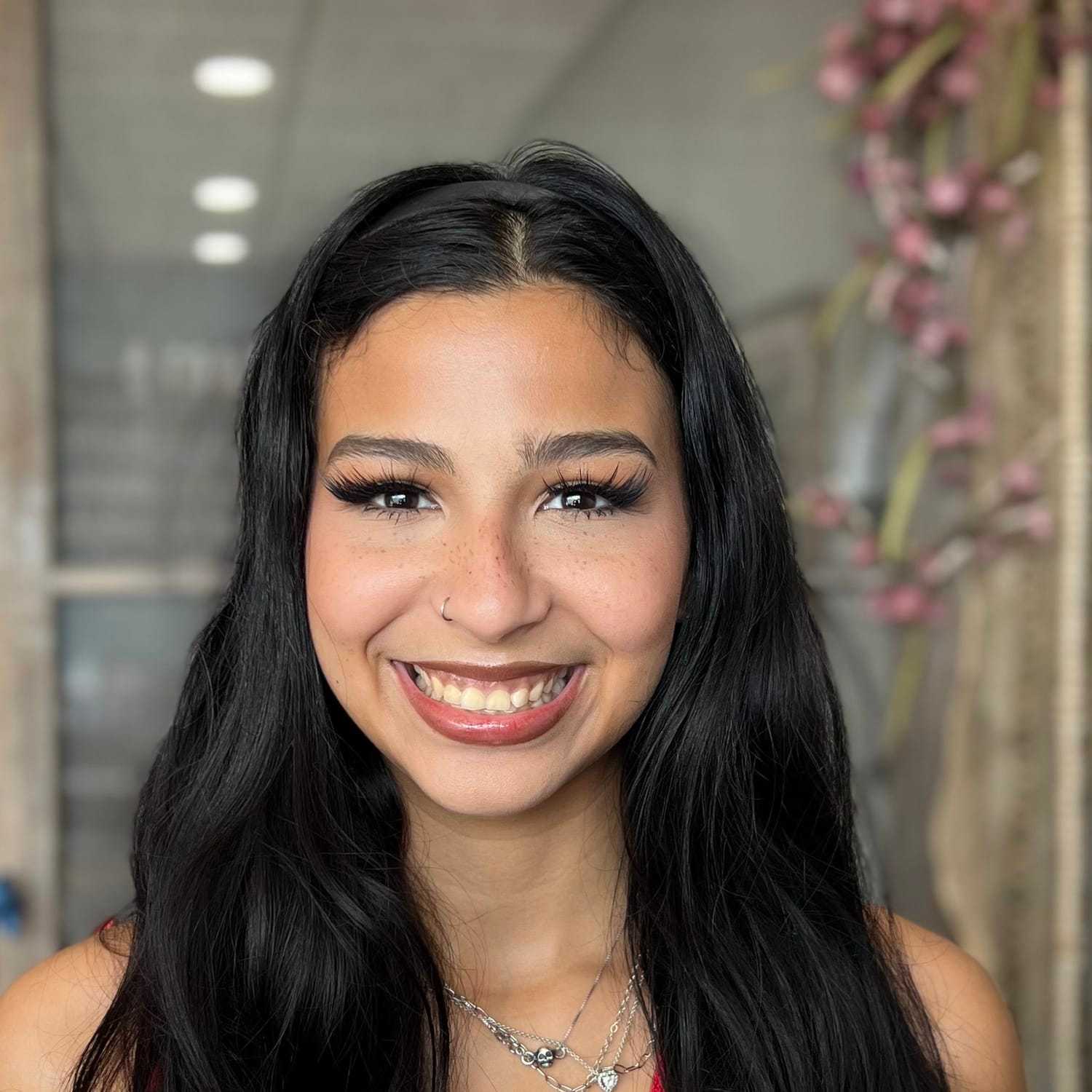 Portrait of Lili Alvarado, a professional stylist at A & M Inc., showcasing their expertise and style.